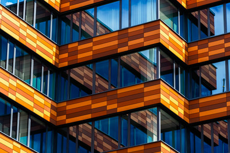 Office building with orange and brown horizontal panelsの写真素材