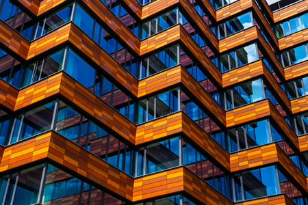 Office building with orange and brown horizontal panelsの写真素材