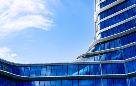 Modern Multi-Story Residential Building with Vibrant Facade, Large Balconies, and Scenic Urban...
