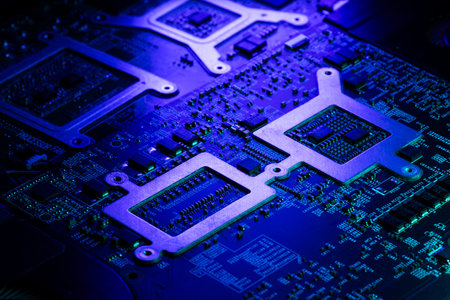 Macro View of Laptop Internal Components and PCB with Green and Blue Futuristic Accent Lighting