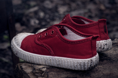 Lonely dirty children's shoesの写真素材