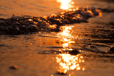 Coastal waves of the Asian riverの写真素材