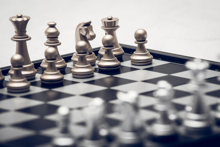 Chess pieces in different combinations on a black and white board