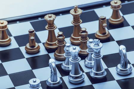 Chess pieces in different combinations on a black and white board