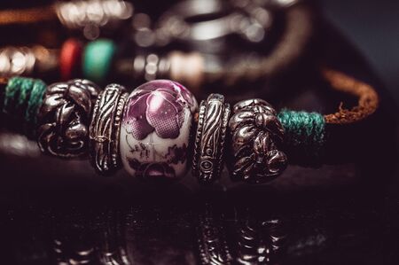 Handmade leather bracelet on glassの写真素材