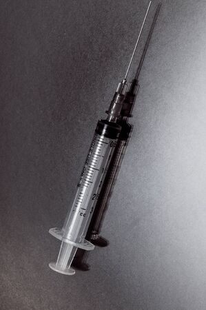 A disposable empty syringe life or deathの写真素材