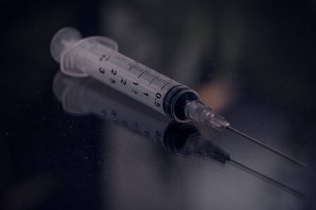 A disposable empty syringe life or deathの写真素材