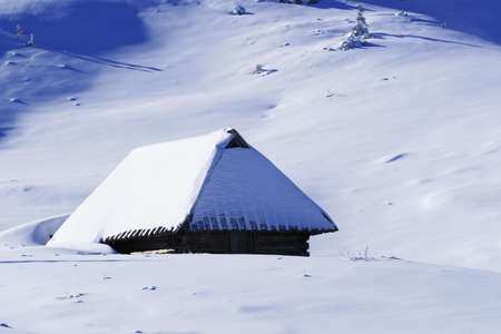 Mountain chalet in winterの写真素材