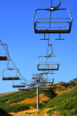Empty mountain ski chairlift in the summerの写真素材