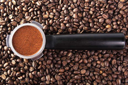 Filter holder for coffee machine on coffe beansの写真素材