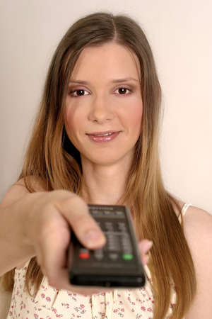 young blond woman with a remote control