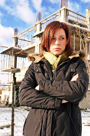 girl, young woman at  a building site- thinking