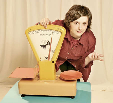 woman, salesperson with an old-type scaleの写真素材