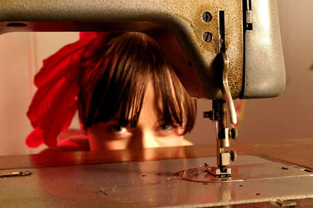 girl, young woman with a sawing machine and feathers