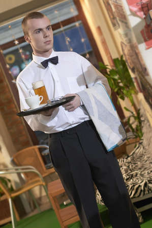 waiter serving beer and coffe in coffe bar