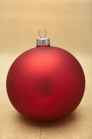Red christmas decoration on gold background.の写真素材