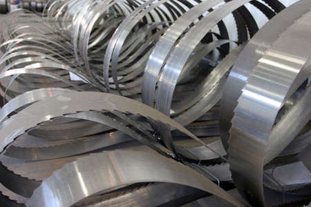 Lumber being processed at a forest products sawmill-blades
