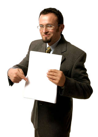 Young handsome  businessman pointing to a blank sheet of paper.の写真素材
