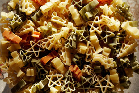 Colourfull christmas decorations- stars and trees made from pasta.の写真素材