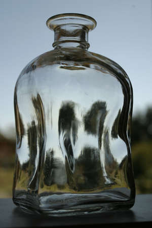 Empty thick glass bottle in close up view.の写真素材