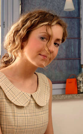 Young beautiful blonde woman with curly hair and romantic look.の写真素材