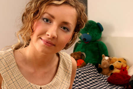 Young beautiful blonde woman with curly hair and romantic look.の写真素材