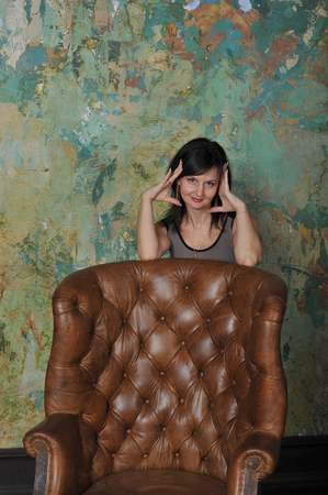 the girl next to the chairの写真素材