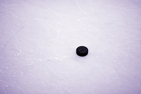 hockey puck on iceの写真素材