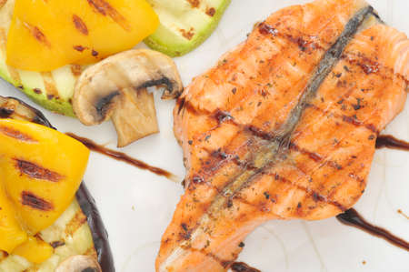 grilled salmon, zucchini, eggplant, mushrooms, peppers. top viewの写真素材
