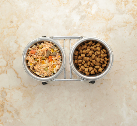 dog food in a metal bowl. dog food and dry food. top viewの写真素材