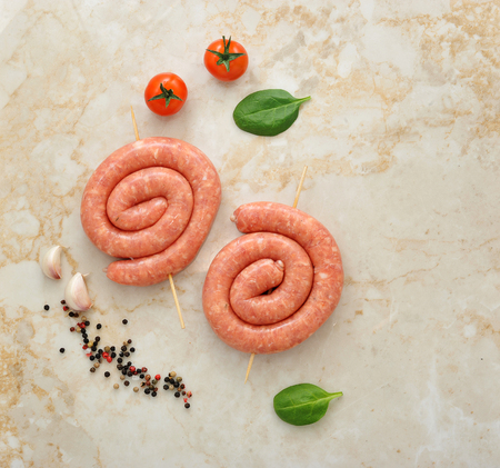 two raw sausages on skewers. top viewの写真素材