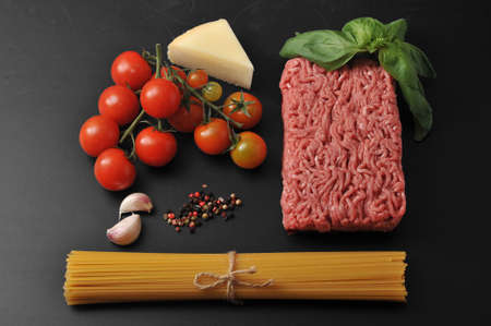 set of products for cooking Italian dishes - spaghetti Bolognese. Ground beef, spaghetti, cheese,...
