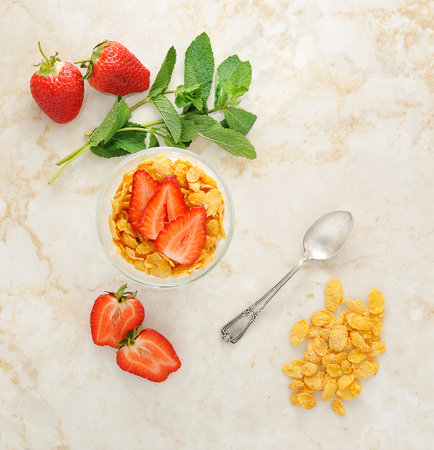 corn flakes and strawberries for Breakfast. top viewの写真素材