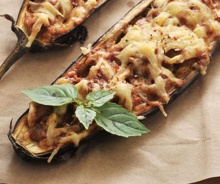 Baked stuffed eggplant with cheese on the paperの写真素材