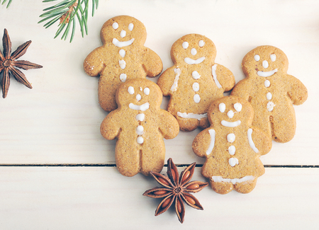 gingerbread men cookies on wooden background - top viewの写真素材