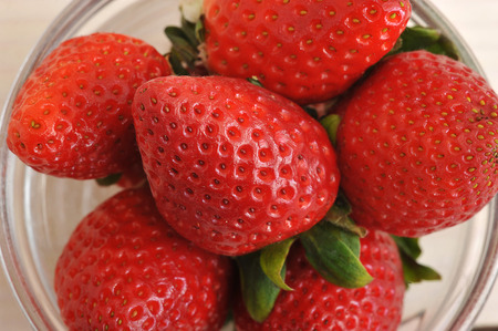 red ripe strawberries in a bowl - top view, closeupの写真素材