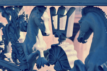 iron railings of the fence with horses on Blagoveshchensky bridge in St. Petersburg, Russiaの写真素材