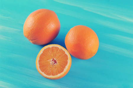 group of fresh juicy orange, cut in half - the closeup