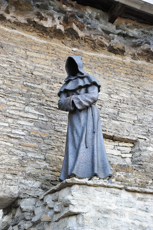 Tallinn, Estonia - 06 May 2018: bronze sculpture of a monk without a face in the old town in Tallinnのeditorial素材