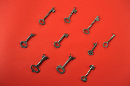 vintage key background on red with space for text top viewの写真素材