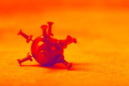 covid-19 coronavirus- a virus on a red background with a dramatic colorの写真素材