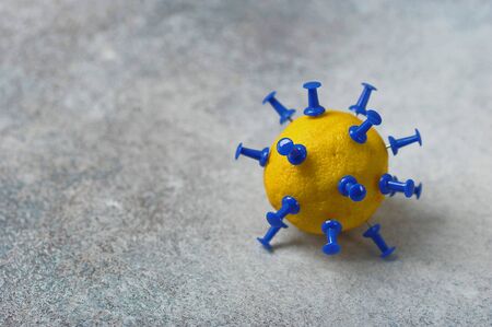 lemon with needles - model corona virus covid-19の写真素材