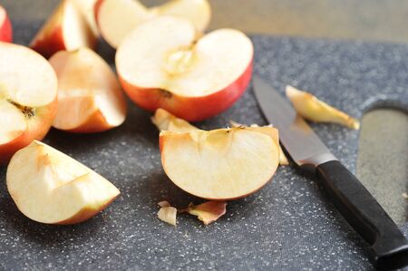 sliced red apples on a Board with a knife. apples view