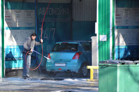Saint Petersburg, Russia - March 22, 2020: self-service car wash - a man washes his carのeditorial素材