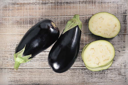 black eggplant on wooden backgroundの写真素材