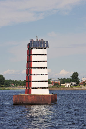 a lighthouse with a solar battery near the sea channel near Kronstadtのeditorial素材