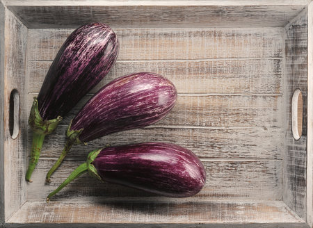 zucchini speckled on a wooden tray top viewの写真素材