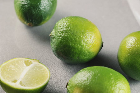 sliced limes on a gray backgroundの写真素材