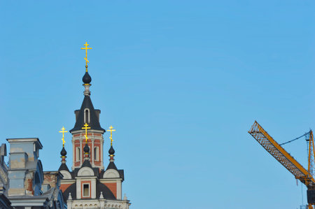 Moscow, Russia - February 22, 2025: view of the Spassky Cathedral and construction crane in Moscowのeditorial素材