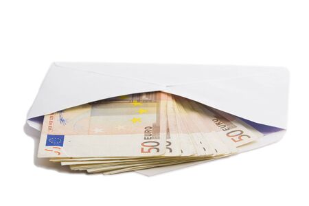 money in envelope isolated on whiteの写真素材